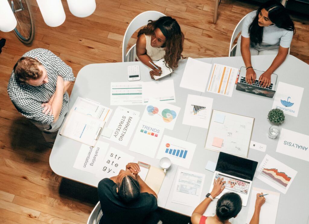 Business people working together at a table in a positive corporate culture